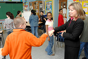 Izzo greets one of her students on his way in to class. She believes in making sure all of her students have a positive interaction with her during the day.