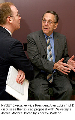 NYSUT Executive Vice President Alan Lubin (right) discusses the tax cap proposal with Newsday’s James Madore. Photo by Andrew Watson.