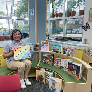 Librarian sitting with books