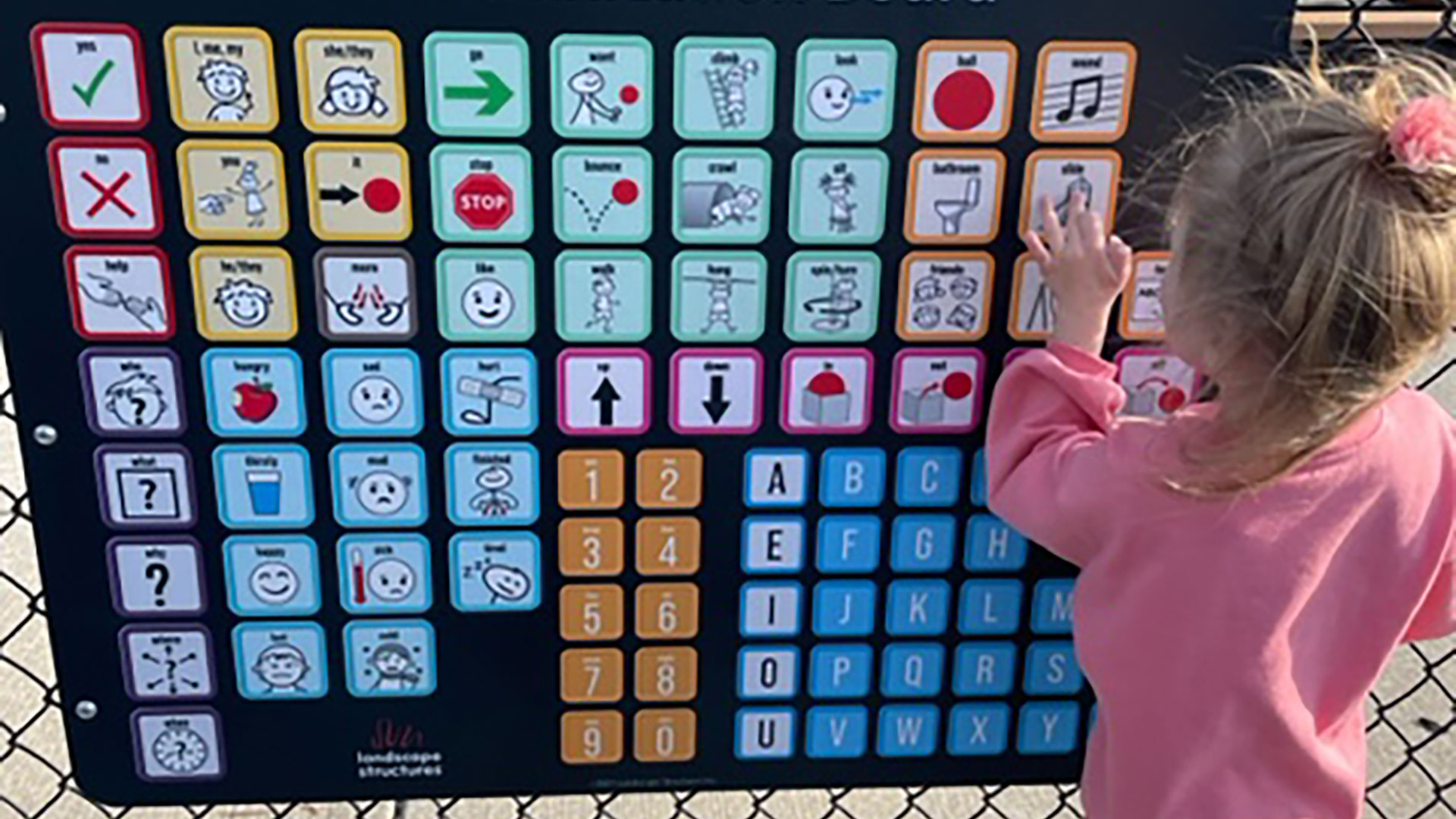 Student using communication board.